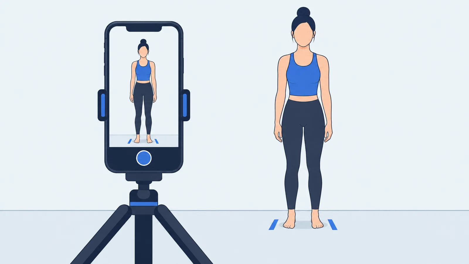 A phone on a tripod framing a full-body photo of a barefoot person in fitted clothing standing in front of a plain wall